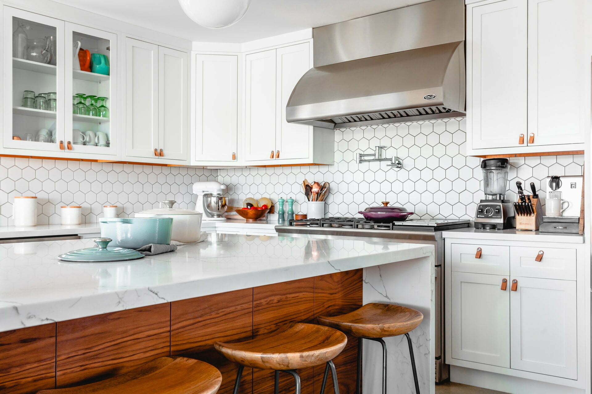 a kitchen with white cabinets